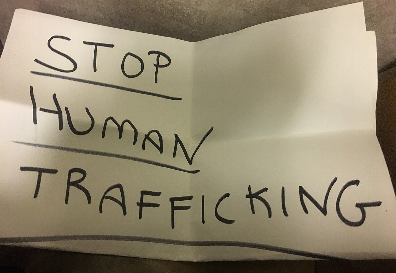 "Stop Human Trafficking" sign for the March 25 Pizzagate march.
