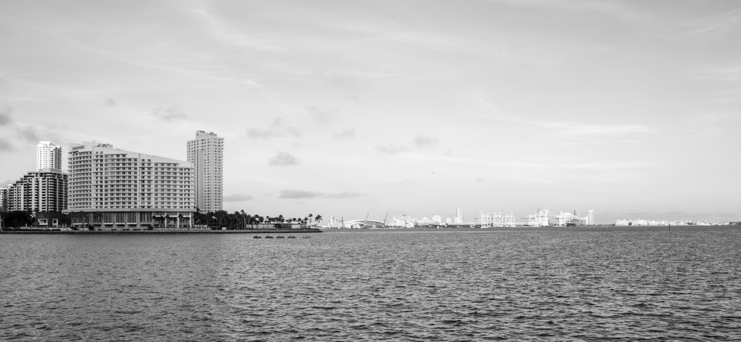 Cityscape view with buildings across a body of water.
